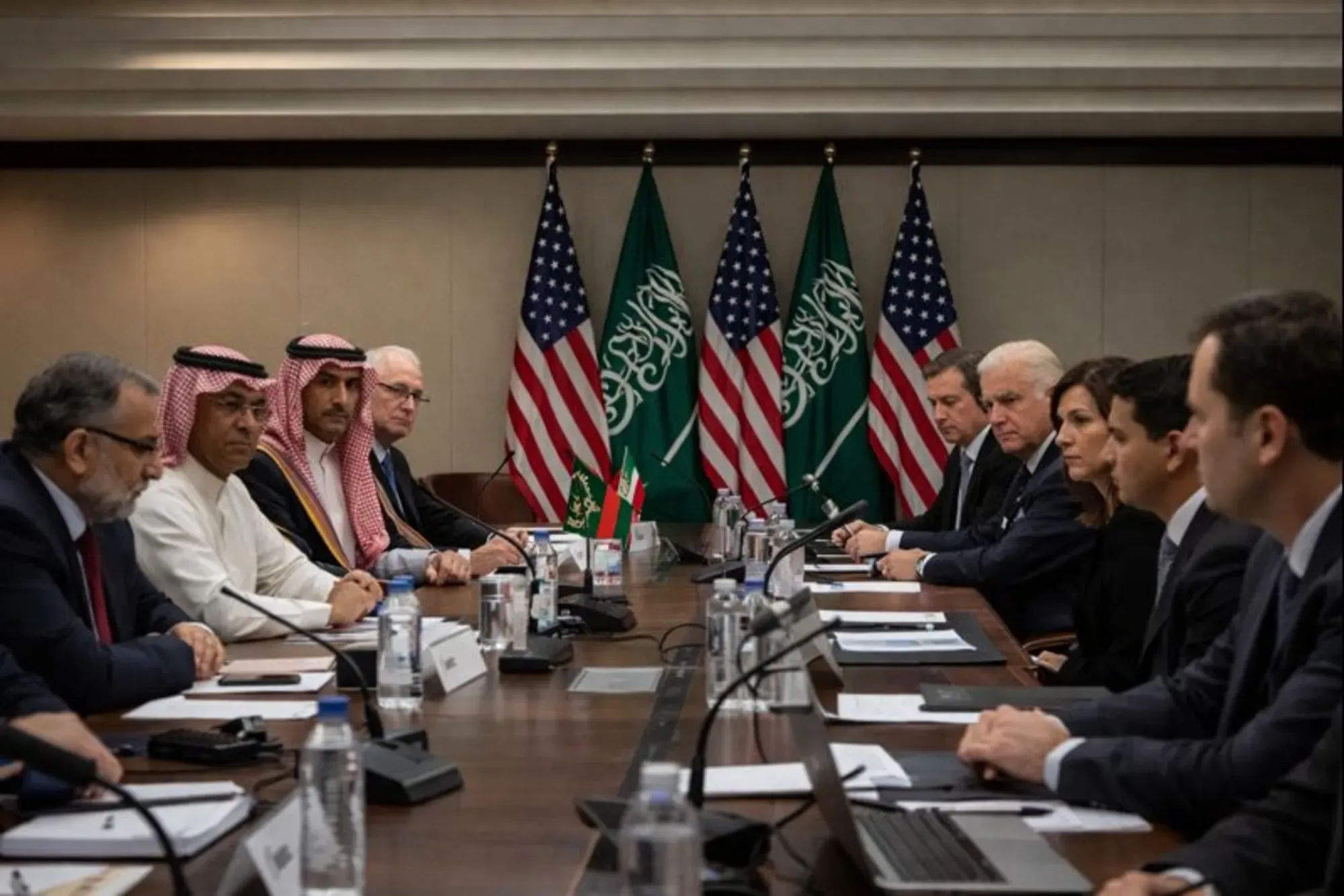 Officials and advisers in a formal meeting discussing diplomatic and security risks related to Iran