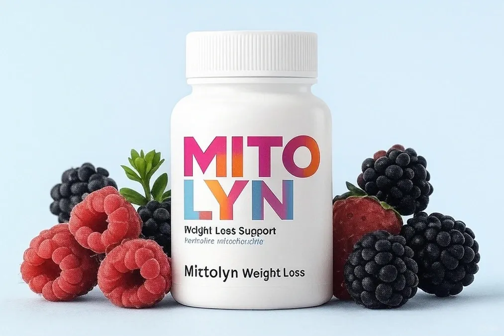 Mitolyn really work product shot with dietary supplement bottle surrounded by fresh mangoes, kiwis, pomegranates, and cacao p