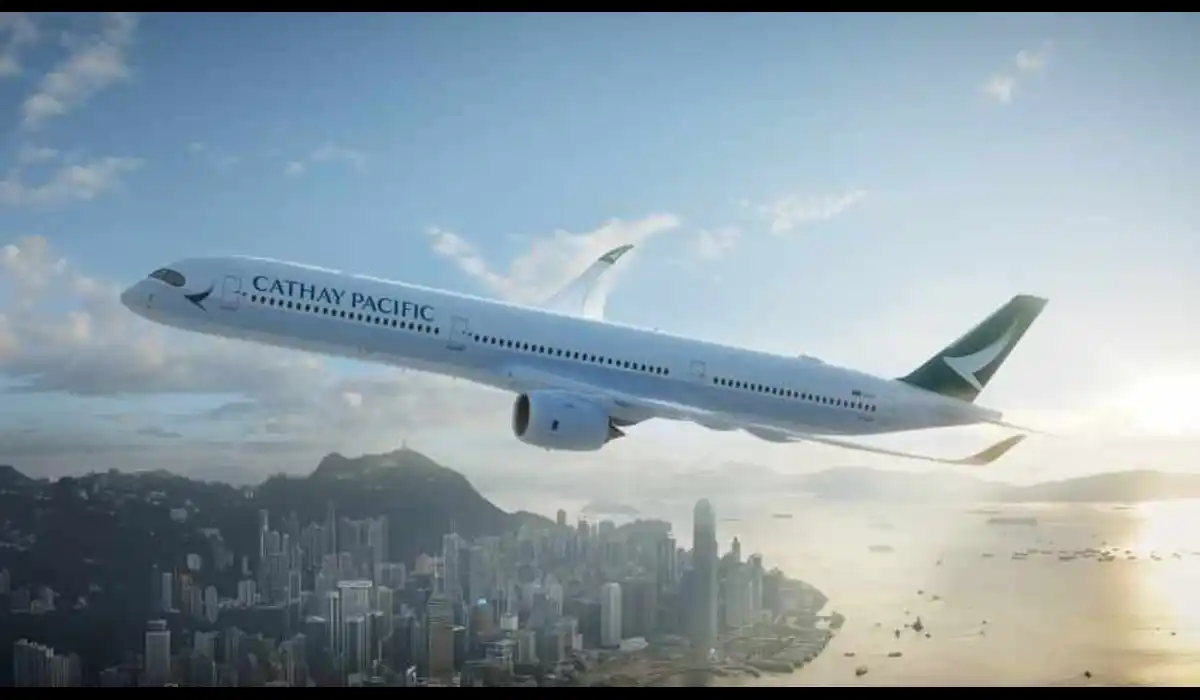 Cathay Pacific Seattle flights Airbus A350 flying over Hong Kong skyline