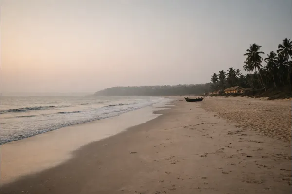 Quiet beach in Goa during soft daylight, showing a calm setting ideal for thoughtful travel planning.